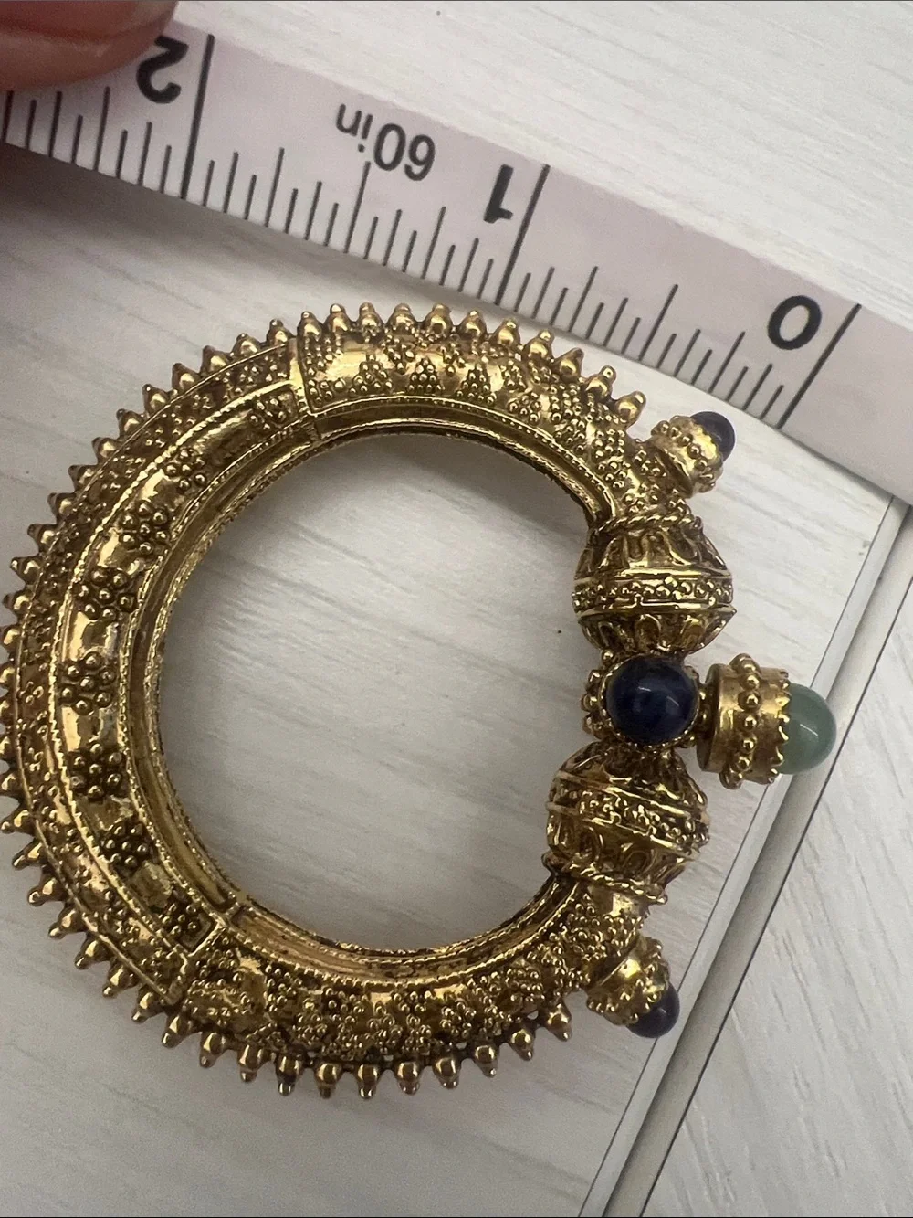 Gold-Tone Textured Hinged Bangle with Blue & Green Cabochons